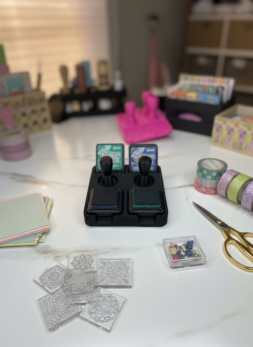 Distress ink pads with a black holder on a white surface