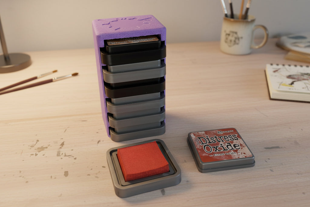 Set of ink stamps with different colors on a white surface
