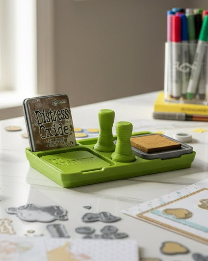 Green ink station with 'Distress Oxide' ink pad on a white surface