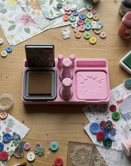 Pink distress oxide kit on a marble surface